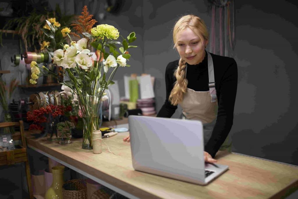 female-florist-using-laptop-work-min female florist using laptop work min
